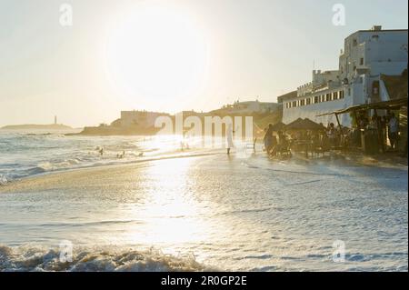 People on the beach and Cape Trafalgar in the background, Los Canos de Meca, Andalusia, Spain, Europe Stock Photo