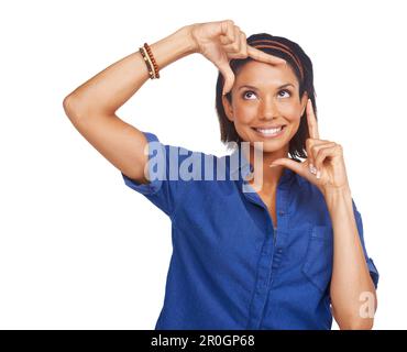 Would you frame this pretty face. A pretty young african american woman framing her face with her hands. Stock Photo