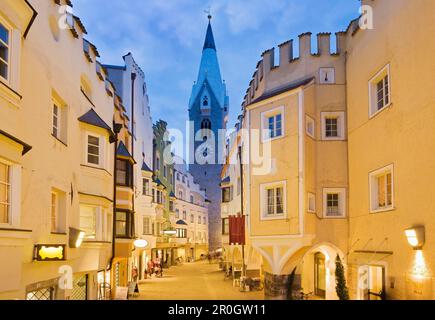 Pedestrian area and steeple in the city in the evening, Brixen, Valle Isarco, South Tyrol, Alto Adige, Italy, Europe Stock Photo