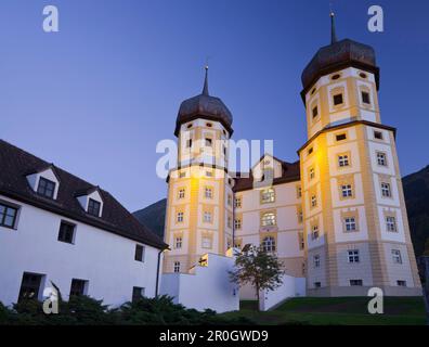 Illuminated Cistercian monastery Stams in the evening, Inntal, Tyrol, Austria, Europe Stock Photo