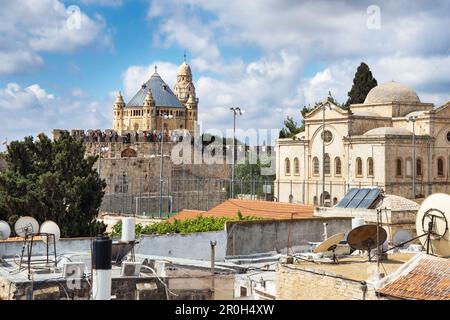 Jerusalem Dormition Abbey church at mount Zion with modern conditioners, satellite dishes and solar panels on the roofs on the foreground Stock Photo