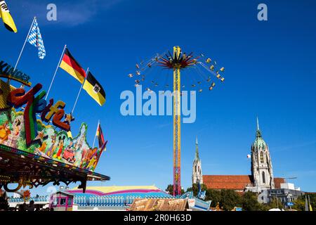 Carousel at the Oktoberfest, St Pauls cathedral, Munich, Upper Bavaria, Bavaria, Germany Stock Photo