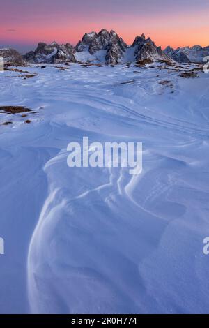 Sunset with snow structures on the plateau of Monte Piano, looking south to the Cadini group, Sexten Dolomites, South Tyrol, Italy Stock Photo