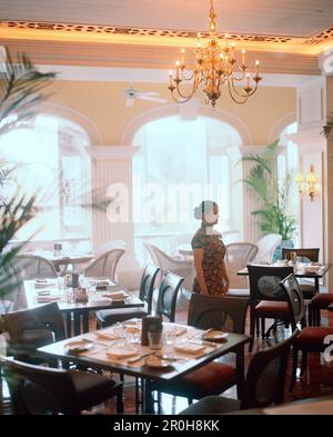 CHINA, Macau, Macau, waitress standing in Bella Vista Cafe Stock Photo