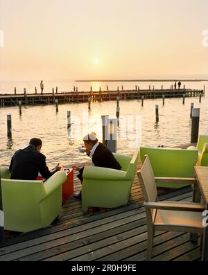 AUSTRIA, Neusiedl Am See, afternoon coffee at the Mole West Café and Bar Restaurant, Lake Neusiedler See, Burgenland Stock Photo