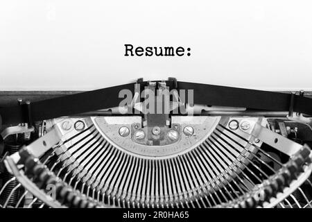 Resume word closeup being typing and centered on a sheet of paper on old vintage typewriter mechanical Stock Photo