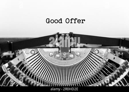 Good offer phrase closeup being typing and centered on a sheet of paper on old vintage typewriter mechanical Stock Photo