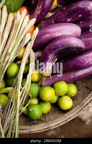 VIETNAM, Hue, an assortment of limes, eggplants and onions at a rural roadside market Stock Photo