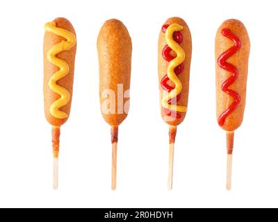 Four corn dogs with different toppings isolated on a white background Stock Photo