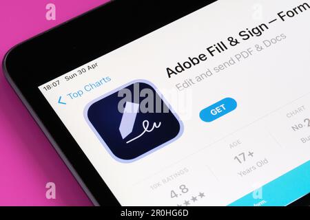 Adobe Fill and Sign app seen in App Store on the screen of ipad. Selective focus. Stafford, United Kingdom, May 6, 2023 Stock Photo