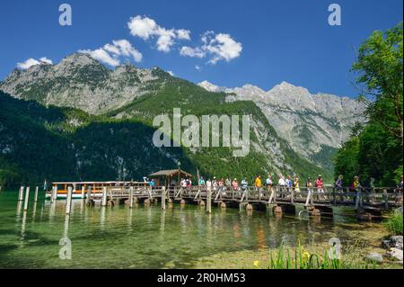 People leaving boat and walking on landing stage, Salet, lake Koenigssee, Berchtesgaden range, National Park Berchtesgaden, Berchtesgaden, Upper Bavar Stock Photo