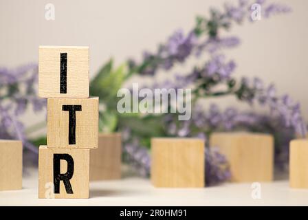 Wooden blocks with the inscription ITR on office desk. Stock Photo