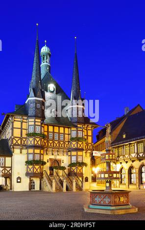 View over market square to illuminated town hall, Wernigerode, Saxony-Anhalt, Germany Stock Photo