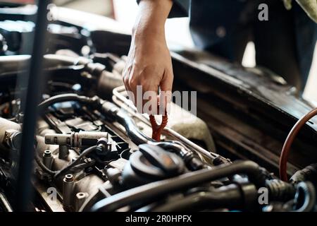 Pulling dipstick out of a car engine to check the oil Stock Photo - Alamy