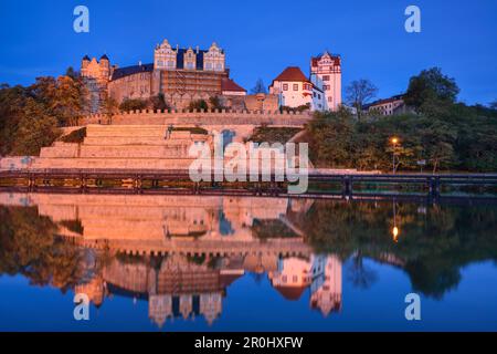 Illuminated Bernburg castle above the river Saale, Bernburg, Saxony-Anhalt, Germany Stock Photo