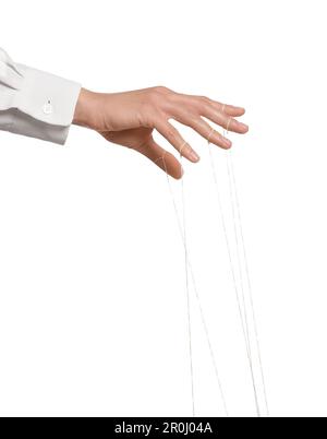 Woman pulling strings of puppet on white background, closeup Stock Photo