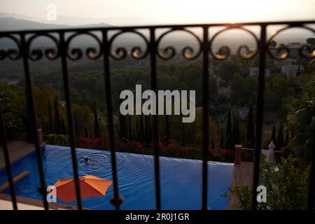 View from a balcony over the swimming pool towards the mountains, Mallorca, Balearic Islands, Spain Stock Photo