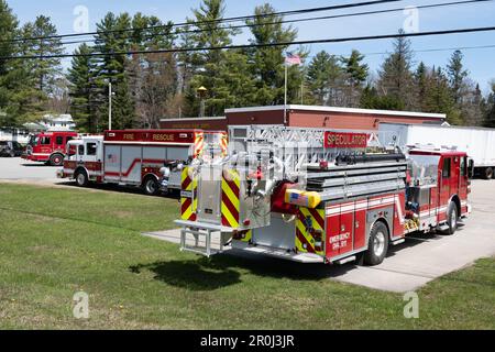 Fire trucks parked outside the Speculator Volunteer Fire Department building for training in Speculator, NY USA Stock Photo