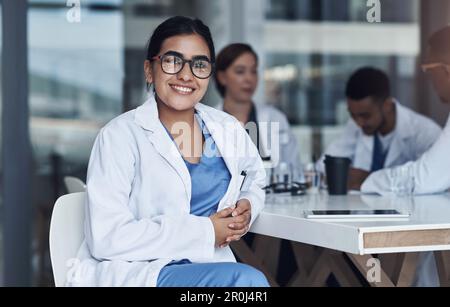 Im so lucky to do what I do. a young female doctor using her digital tablet. Stock Photo