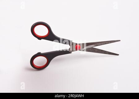 Black and red scissors isolated on white background, clipping path included. Stock Photo