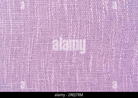 Light purple background from a textile material. Fabric with natural texture. Stock Photo