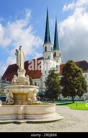 Kapellplatz with Marienbrunnen fountain and collegiate church, Altoetting, Upper Bavaria, Germany Stock Photo