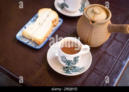 Breakfast with claypot coffee and toast bread. Top view. Stock Photo