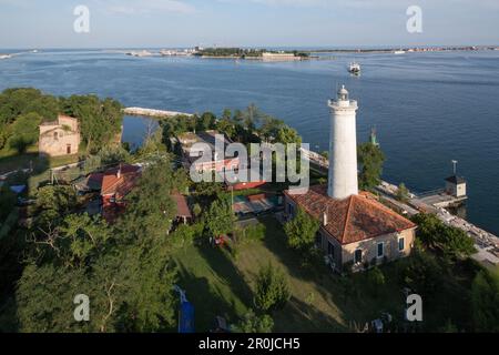 View above old Alberoni lighthouse and the pilot station at the Malamocco exit, end of the Lido, background MOSE, Lagoon, Venice, Italy Stock Photo