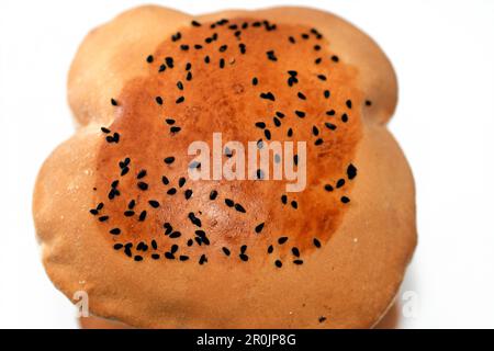 Egyptian Mahlab bread, puff thin, crispy and delicious with black seed baraka seeds on top, made of flour, dry yeast, milk, eggs, sugar, salt, black s Stock Photo