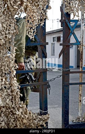 Soldier behind a chained door, Border from Israel to Lebanon, Israel Stock Photo