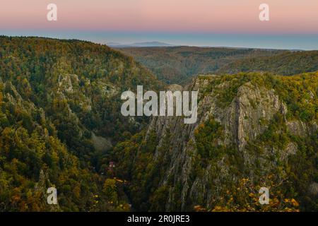 View from Witches dancing place, Hexentanzplatz, towards Roßtrappe, Bode Valley and Brocken mountain in autumn at sunrise,  Thale, Harz Foreland, Harz Stock Photo