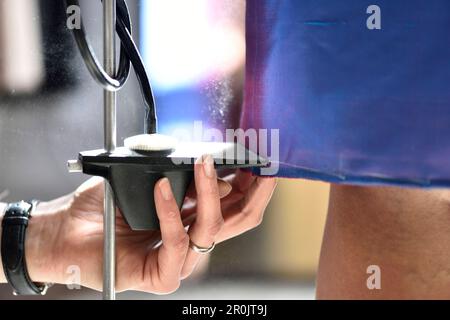 Measuring material with chalk, dressmaking in Hamburg, Germany Stock Photo