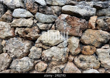 Vintage stonework from old natural stones as background front view close up Stock Photo