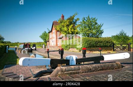 Narrowboat approaching Bratch Locks on the Staffordshire and Worcester Canal, West Midlands near Wombourne,  England, UK, Britain Stock Photo