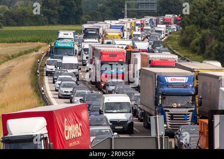 German Autobahn, traffic jam, congestion, A 99, cars, trucks, stopped, halt, motorway, highway, freeway, speed, speed limit, traffic, infrastructure, Stock Photo