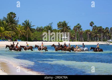 Half Moon Resort horseback ride excursion along Sunrise Beach and in Caribbean Sea Rose Hall, near Montego Bay, Saint James, Jamaica Stock Photo