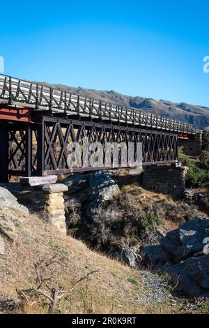 Steel truss bridge on Central Otago Rail Trail, near Hyde, Otago, South Island, New Zealand Stock Photo