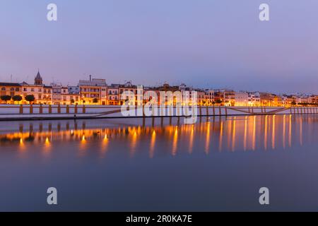 Barrio de Triana in the evening with reflection, Triana quarter, Rio Guadalquivir, river, Calle Betis, Seville, Andalucia, Spain, Europe Stock Photo