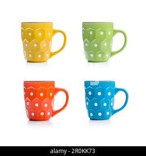 The polka dot mugs isolated on the white background. Stock Photo