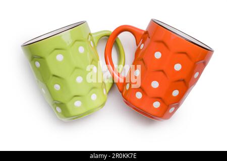 The polka dot mugs isolated on the white background. Stock Photo