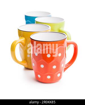 The polka dot mugs isolated on the white background. Stock Photo