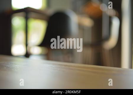 Wood table top on blur restaurant or cafe interior background. Stock Photo