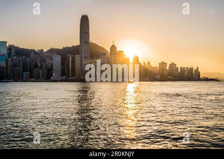 The skyline of Hong Kong Island seen trough the window of a Star Ferry ferry line during sunset, Hong Kong, China, Asia Stock Photo