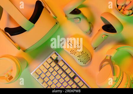 Modern gaming accessories and keyboard on desk Stock Photo