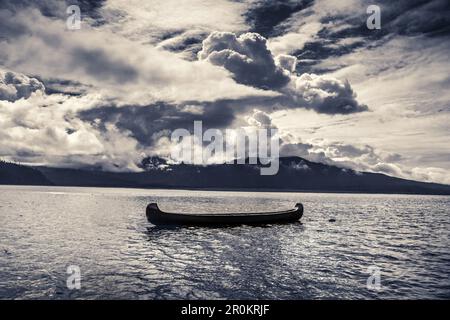 USA, Alaska, Homer, China Poot Bay, Kachemak Bay, a large canoe resting in the waters off of Kachemak Bay Wilderness Lodge Stock Photo