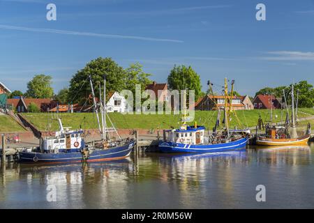 Fishing boats in the harbour of Greetsiel, North Sea, East Frisia, Lower Saxony, Northern Germany, Germany, Europe Stock Photo