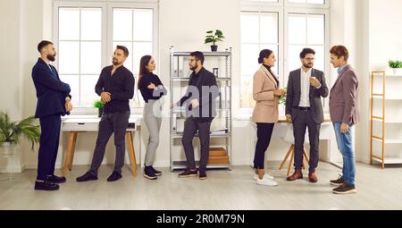 Business colleagues communicating during staff meeting in office Stock Photo
