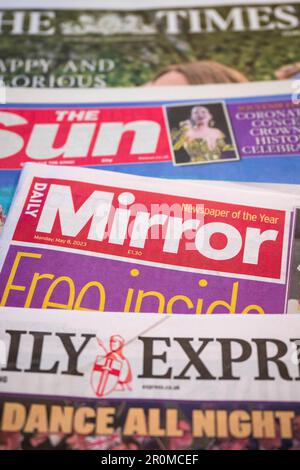 PRODUCTION - 08 May 2023, Great Britain, London: The British newspapers 'Daily Mirror', 'Daily Express', 'The Sun' and 'The Times' are on a table. Photo: Sina Schuldt/dpa Stock Photo
