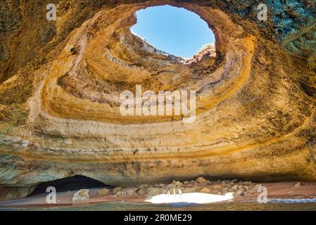 Giant beach cave with hole in the ceiling at Benagil, Algarve, Portugal Stock Photo