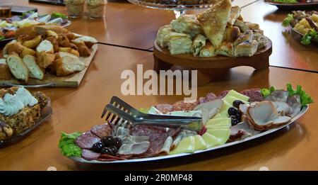 Plate of mixed meats and cheeses. Stock Photo